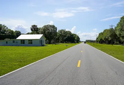 rural highway road with white home
