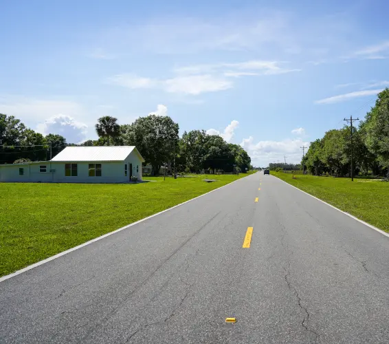 rural highway road with white home